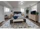 Cozy bedroom featuring a king bed, ample lighting, and decor for a comfortable and stylish living space at 336 Sir Richard Ct, Jonesboro, GA 30236