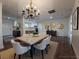 Elegant dining room featuring a modern chandelier and stylish decor, hardwood floor at 336 Sir Richard Ct, Jonesboro, GA 30236