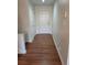 Inviting foyer with white front door, complemented by neutral paint and flooring for a clean, modern aesthetic at 336 Sir Richard Ct, Jonesboro, GA 30236