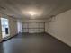 Spacious and clean garage with ample room for storage and parking with painted floor at 336 Sir Richard Ct, Jonesboro, GA 30236