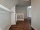 Bright hallway features hardwood floors, fresh paint, and an open doorway, creating a seamless flow throughout the home at 336 Sir Richard Ct, Jonesboro, GA 30236