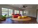 Bright living room with large windows offering views of the backyard lake view at 336 Sir Richard Ct, Jonesboro, GA 30236