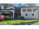 Back of house features a multi-level deck and green lawn at 336 Sir Richard Ct, Jonesboro, GA 30236