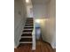 Beautiful staircase with wood steps and white railings, connecting multiple levels at 336 Sir Richard Ct, Jonesboro, GA 30236