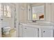 Cozy bathroom features a vanity with a sink, toilet, and shower stall, providing all essential amenities at 545 Bellemeade Sw Dr, Marietta, GA 30008