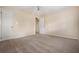 Bedroom features neutral walls, carpet flooring, a ceiling fan, and doorway to the hallway at 545 Bellemeade Sw Dr, Marietta, GA 30008