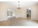Open-concept dining room featuring tile flooring and connections to living room and kitchen areas at 545 Bellemeade Sw Dr, Marietta, GA 30008