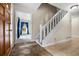 Welcoming foyer with tile flooring and a staircase leading to the upper level at 545 Bellemeade Sw Dr, Marietta, GA 30008
