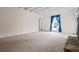 Bright living room features plush carpeting, white wood beams, and bright blue curtains framing the sunlit window at 545 Bellemeade Sw Dr, Marietta, GA 30008