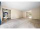 Spacious living room with neutral carpet and multiple access points to other areas of the home at 545 Bellemeade Sw Dr, Marietta, GA 30008