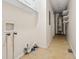 The utility room features tile flooring, a hot water tank, built-in shelving, and washer/dryer hookups at 545 Bellemeade Sw Dr, Marietta, GA 30008