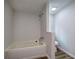 Bathroom featuring a soaking tub, shower, and toilet at 643 Tumlin Lake Rd, Temple, GA 30179