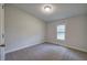 Neutral bedroom with carpeted floors and a single window offering natural light at 643 Tumlin Lake Rd, Temple, GA 30179