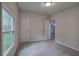 Inviting bedroom featuring soft carpet, neutral paint, and access to the ensuite bathroom at 643 Tumlin Lake Rd, Temple, GA 30179