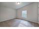 Bright bedroom with neutral walls, carpet flooring, and natural light from a window at 643 Tumlin Lake Rd, Temple, GA 30179