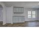 Open dining room with a window view and modern cabinets at 643 Tumlin Lake Rd, Temple, GA 30179