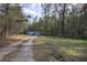 Secluded single Gathering home surrounded by dense trees, offering privacy and a serene, natural setting at 643 Tumlin Lake Rd, Temple, GA 30179