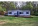 Charming single-story home with a well-maintained lawn and blue shutters, offering a cozy and inviting curb appeal at 643 Tumlin Lake Rd, Temple, GA 30179