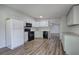 Modern kitchen with stainless appliances and open layout at 643 Tumlin Lake Rd, Temple, GA 30179