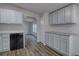 Charming kitchen with granite countertops, stainless steel appliances, and light wood floors at 643 Tumlin Lake Rd, Temple, GA 30179