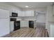 Modern kitchen with stainless appliances and open layout at 643 Tumlin Lake Rd, Temple, GA 30179