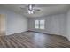 Bright living room with hardwood floors and a modern ceiling fan at 643 Tumlin Lake Rd, Temple, GA 30179