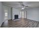 Bright living room with hardwood floors and a cozy fireplace feature at 643 Tumlin Lake Rd, Temple, GA 30179