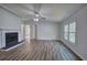 Bright living room with hardwood floors and a cozy fireplace feature at 643 Tumlin Lake Rd, Temple, GA 30179
