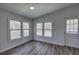 Bright sun room with large windows and vinyl floors at 643 Tumlin Lake Rd, Temple, GA 30179