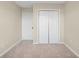 Bright bedroom featuring a double door closet and neutral walls at 109 Odyssey, Conyers, GA 30012