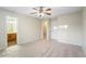 Inviting bedroom featuring neutral walls, carpet, and access to an ensuite bathroom at 109 Odyssey, Conyers, GA 30012