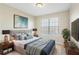Comfortable bedroom with modern design and decor and a large window at 109 Odyssey, Conyers, GA 30012