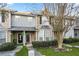 Inviting townhome with manicured front yard, sidewalk and covered porch at 109 Odyssey, Conyers, GA 30012