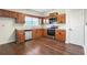 Efficient kitchen with stainless steel appliances, wooden cabinets and a convenient layout at 109 Odyssey, Conyers, GA 30012