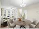 Inviting living room filled with light boasting a ceiling fan, multiple windows and hardwood floors at 109 Odyssey, Conyers, GA 30012