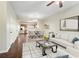 Open-concept living area with hardwood floors, neutral walls, and a view of the kitchen at 109 Odyssey, Conyers, GA 30012