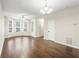 Spacious living room featuring hardwood floors, neutral walls, abundant natural light from multiple windows at 109 Odyssey, Conyers, GA 30012