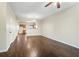 Spacious living room with hardwood floors leading to an open kitchen area at 109 Odyssey, Conyers, GA 30012