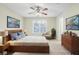 Serene bedroom with natural light, fan, neutral paint, and stylish decor at 109 Odyssey, Conyers, GA 30012