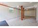 The basement has carpeted floors, white walls and wooden columns at 4151 Valley Wood Nw Dr, Marietta, GA 30064