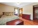 A cozy bedroom with laminate wood floors, neutral walls, a comfy bed and one window at 4151 Valley Wood Nw Dr, Marietta, GA 30064
