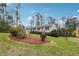 Neat single-story home with lovely landscaping, including fresh mulch and trimmed shrubs, on a bright day at 4151 Valley Wood Nw Dr, Marietta, GA 30064