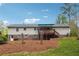 Rear exterior view of house, showcasing a spacious deck and well-kept lawn with a treed backdrop at 4151 Valley Wood Nw Dr, Marietta, GA 30064