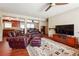 Inviting living room featuring comfortable leather seating, hardwood floors, and a modern entertainment center at 4151 Valley Wood Nw Dr, Marietta, GA 30064