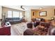 Cozy living room with leather furniture set on an area rug with hardwood flooring and a ceiling fan at 4151 Valley Wood Nw Dr, Marietta, GA 30064
