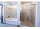 Modern bathroom featuring separate tub and glass-enclosed shower with stylish tile work at 5300 Peachtree Rd # 3206, Atlanta, GA 30341