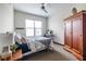 Cozy bedroom featuring a bed, window, workspace, and wardrobe for comfortable living at 5300 Peachtree Rd # 3206, Atlanta, GA 30341