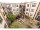 Overhead shot of a lovely apartment complex courtyard with a fountain and seating areas at 5300 Peachtree Rd # 3206, Atlanta, GA 30341