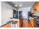 Bright kitchen includes an island with stools, stainless appliances, and wood cabinetry at 5300 Peachtree Rd # 3206, Atlanta, GA 30341