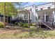 Backyard view showcasing outdoor living spaces, private patios and lush landscaping at 1337 Grey Fox Ne Ct, Atlanta, GA 30306